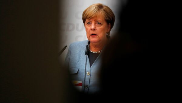 Christian Democratic Union CDU party leader and German Chancellor Angela Merkel reacts during a news conference at the CDU party headquarters, a day after the general election (Bundestagswahl) in Berlin, Germany September 25, 2017. - Sputnik International