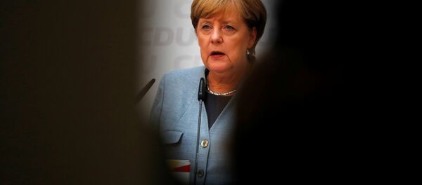 Christian Democratic Union CDU party leader and German Chancellor Angela Merkel reacts during a news conference at the CDU party headquarters, a day after the general election (Bundestagswahl) in Berlin, Germany September 25, 2017. - Sputnik International
