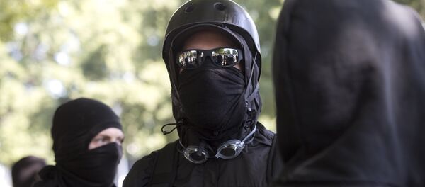 Antifa protesters wear bandanas over their face during a protest to oppose the right wing group The Patriot Prayer Movement, that was having a rally in downtown Portland, Oregon on September 10, 2017. Antifa protesters wear bandanas over their face during a protest to oppose the right wing group The Patriot Prayer Movement, that was having a rally in downtown Portland, Oregon on September 10, 2017. - Sputnik International