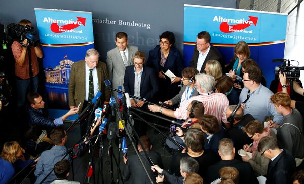 Anti-immigration party Alternative fuer Deutschland AfD top candidates Alice Weidel and Alexander Gauland address a news conference before a get together for their first parliamentary meeting in Berlin, Germany September 26, 2017 Anti-immigration party Alternative fuer Deutschland AfD top candidates Alice Weidel and Alexander Gauland address a news conference before a get together for their first parliamentary meeting in Berlin, Germany September 26, 2017 - Sputnik International