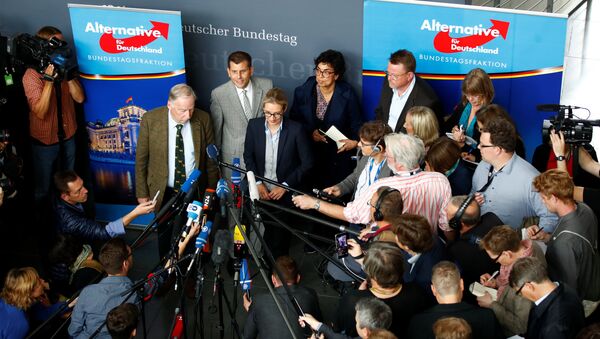 Anti-immigration party Alternative fuer Deutschland AfD top candidates Alice Weidel and Alexander Gauland address a news conference before a get together for their first parliamentary meeting in Berlin, Germany September 26, 2017 - Sputnik International
