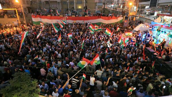 Kurds celebrate to show their support for the independence referendum in Duhok, Iraq - Sputnik International