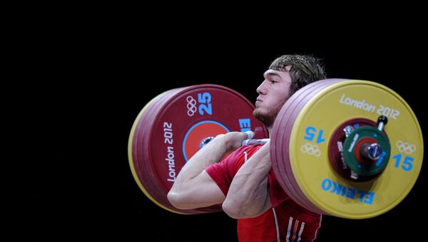 (File) Russia's Apti Aukhadov takes part in the men's 85 kg weightlifting event at the 30th Olympic Games in London - Sputnik International