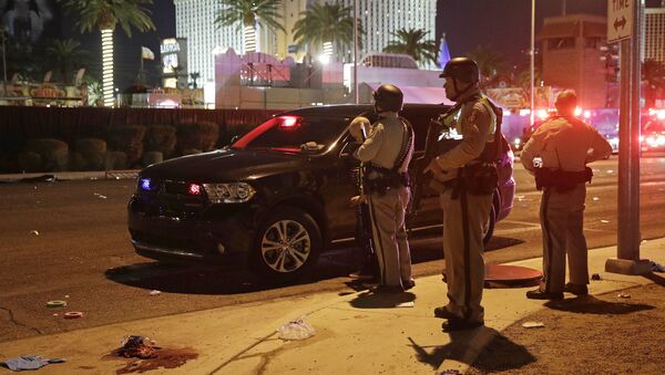 Police stand at the scene of a shooting along the Las Vegas Strip, Monday, Oct. 2, 2017, in Las Vegas - Sputnik International