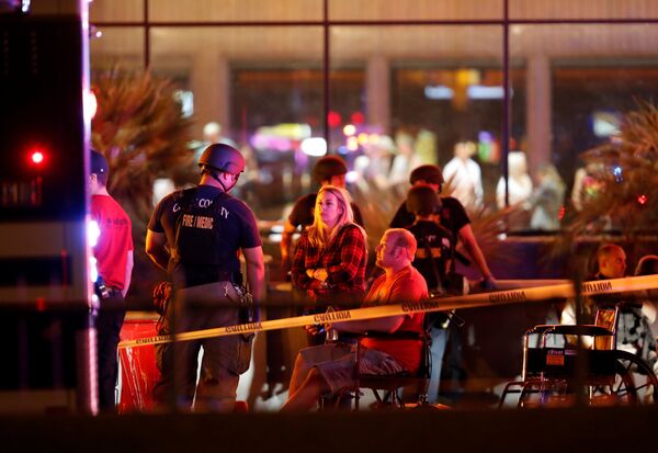 People wait in a medical staging area on October 2, 2017, after a mass shooting during a music festival in Las Vegas, Nevada, U.S - Sputnik International