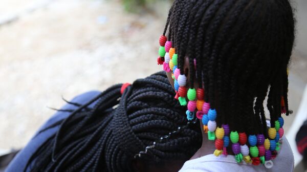 Jacquendia rests her head under her daughter, who will not be identified at her mother's request - Sputnik International