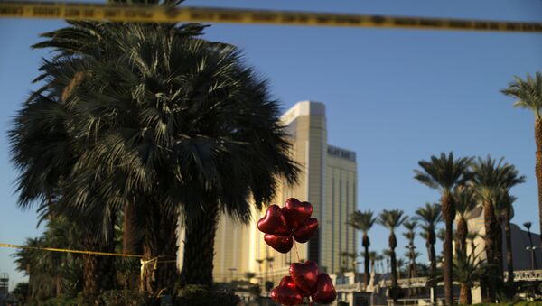 A makeshift memorial is seen next to the site of the Route 91 music festival mass shooting outside the Mandalay Bay Resort and Casino in Las Vegas, Nevada, U.S - Sputnik International