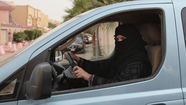 A woman drives a car in Riyadh, Saudi Arabia as part of a campaign to defy Saudi Arabia's ban on women driving (File) - Sputnik International