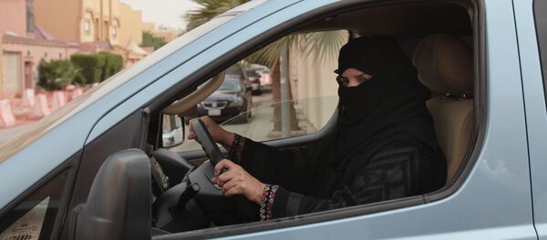 A woman drives a car in Riyadh, Saudi Arabia as part of a campaign to defy Saudi Arabia's ban on women driving (File) - Sputnik International