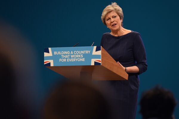 Britain's Prime Minister Theresa May delivers her speech on the final day of the Conservative Party annual conference at the Manchester Central Convention Centre in Manchester, northwest England. Britain's Prime Minister Theresa May delivers her speech on the final day of the Conservative Party annual conference at the Manchester Central Convention Centre in Manchester, northwest England. - Sputnik International
