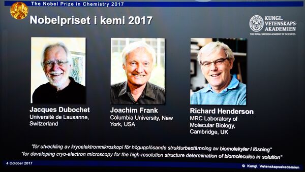 A screen displays portraits of winners of the 2017 Nobel Prize in Chemistry on October 4, 2017 at the Royal Swedish Academy of Sciences in Stockholm, Sweden (L-R) Jacques Dubochet from Switzerland, Joachim Frank from the US and Richard Henderson from Britain - Sputnik International