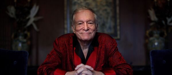 In this Nov. 4, 2010, file photo, Playboy magazine founder Hugh Hefner poses for photos at the Playboy Mansion in Los Angeles. In this Nov. 4, 2010, file photo, Playboy magazine founder Hugh Hefner poses for photos at the Playboy Mansion in Los Angeles. - Sputnik International