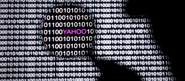 A man in front of a Yahoo logo seen through a magnifying glass in front of a displayed cyber code (File) A man in front of a Yahoo logo seen through a magnifying glass in front of a displayed cyber code (File) - Sputnik International