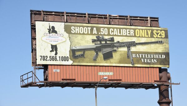 A billboard advertises a gun shooting range in Las Vegas, Nevada on October 4, 2017 - Sputnik International