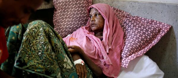 Shaheda, 40, a Rohingya refugee woman who said her body was burnt when the Myanmar army set fire to her house, receives treatment at the Cox's Bazar District Sadar Hospital in Cox's Bazar, Bangladesh, September 13, 2017 - Sputnik International