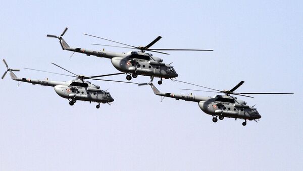 Indian Air Force's Mi- 17 V5 helicopters fly-past during President's standard and colour presentation at Air Force station in Jamnagar, India, Friday, March 4, 2016 - Sputnik International
