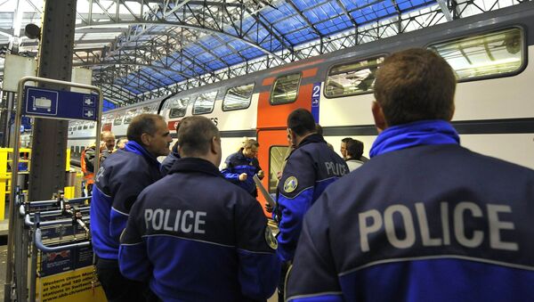 (File) Policemen stand on a platform of Lausanne main station Monday, April 27, 2009 - Sputnik International