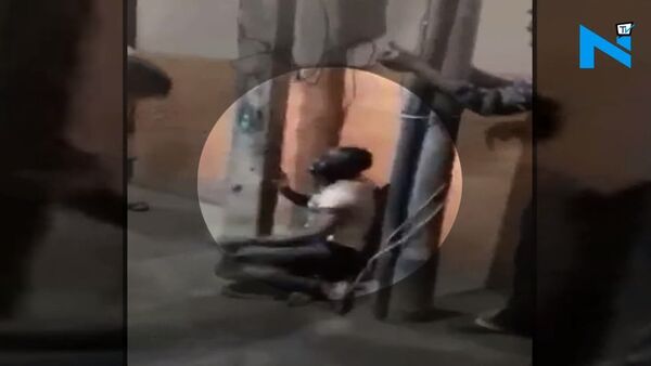 Nigerian tied to post, brutally thrashed by mob in Delhi - Sputnik International