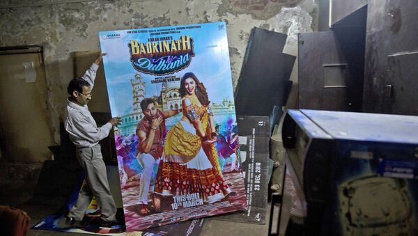 In this Tuesday, March 28, 2017 photo, an employee places a poster of a Bollywood film in the dump room of Regal Theater in New Delhi, India - Sputnik International