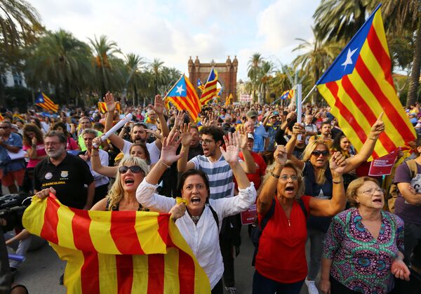 People wave separatist Catalonian flags at a rally in support of independence in Barcelona, Spain People wave separatist Catalonian flags at a rally in support of independence in Barcelona, Spain - Sputnik International