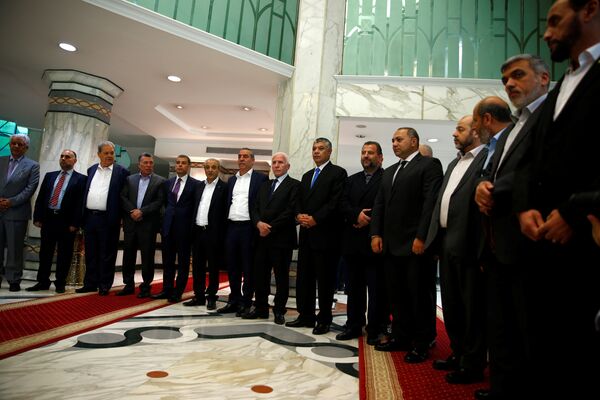 Hamas and Fatah officials pose during a reconciliation ceremony in Cairo, Egypt Hamas and Fatah officials pose during a reconciliation ceremony in Cairo, Egypt - Sputnik International