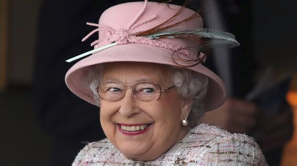 Britain's Queen Elizabeth II smiles as she attends an event at Newbury Racecourse in Newbury England, Friday April 21, 2017. - Sputnik International