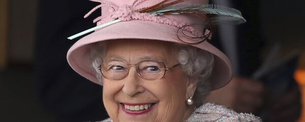 Britain's Queen Elizabeth II smiles as she attends an event at Newbury Racecourse in Newbury England, Friday April 21, 2017. - Sputnik International