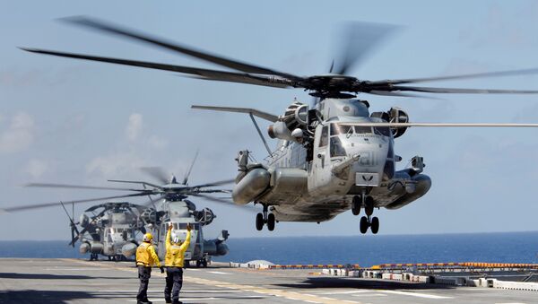 A Marine Corps CH-53 Super Stallion lifts off from the USS Kearsarge as U.S. military personnel continue to evacuate the U.S. Virgin Islands in advance of Hurricane Maria, in the Caribbean Sea near the islands September 18, 2017 - Sputnik International
