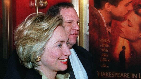 First lady Hillary Rodham Clinton walks with Miramax Co-Chairman Harvey Weinstein into the premier of her new movie Shakespeare in Love, in New York. (File) - Sputnik International