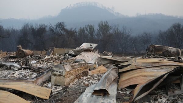 A structure destroyed by wildfire smolders outside Calistoga, California, U.S. October 12, 2017. - Sputnik International