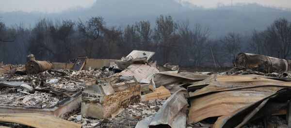 A structure destroyed by wildfire smolders outside Calistoga, California, U.S. October 12, 2017. A structure destroyed by wildfire smolders outside Calistoga, California, U.S. October 12, 2017. - Sputnik International