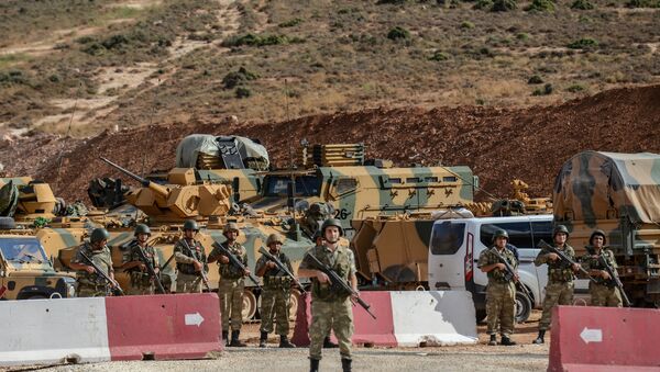 Turkish soldiers stand near armoured vehicles during a demonstration in support of the Turkish army's Idlib operation near the Turkey-Syria border near Reyhanli, Hatay, on October 10, 2017 - Sputnik International