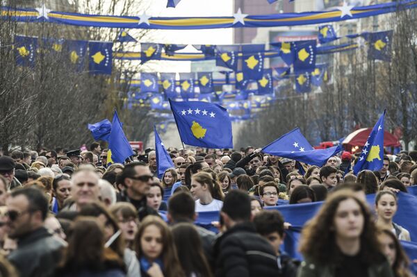 People wave flags and carry banners as they gather in Pristina on February 17, 2017 during the celebrations marking the 9th anniversary of Kosovo's declaration of independence People wave flags and carry banners as they gather in Pristina on February 17, 2017 during the celebrations marking the 9th anniversary of Kosovo's declaration of independence - Sputnik International