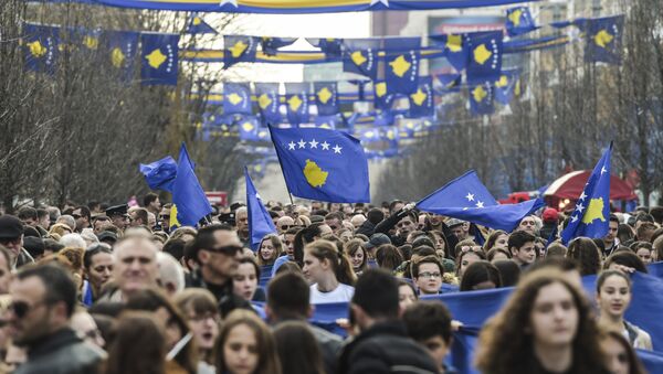 People wave flags and carry banners as they gather in Pristina on February 17, 2017 during the celebrations marking the 9th anniversary of Kosovo's declaration of independence - Sputnik International