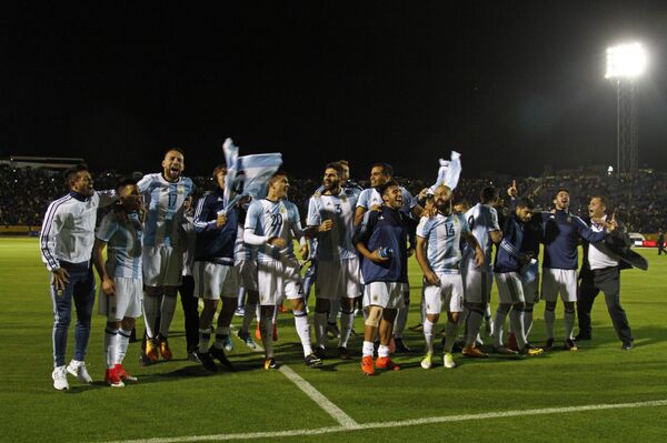 Players of Argentina celebrate after defeating Ecuador and qualifying to the 2018 World Cup football tournament, in Quito, on October 10, 2017 - Sputnik International