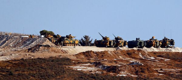 Turkish military vehicles are seen on the Turkish-Syrian border line in Reyhanli, Hatay province, Turkey, October 13, 2017 - Sputnik International