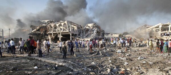 Somalis gather and search for survivors by destroyed buildings at the scene of a blast in the capital Mogadishu, Somalia, Saturday, Oct. 14, 2017 Somalis gather and search for survivors by destroyed buildings at the scene of a blast in the capital Mogadishu, Somalia, Saturday, Oct. 14, 2017 - Sputnik International