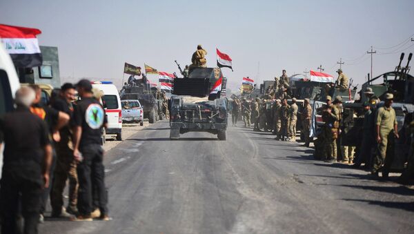 Members of Iraqi federal forces gather to continue to advance in military vehicles in Kirkuk, Iraq October 16, 2017 - Sputnik International