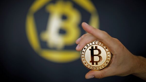 A Bitcoin (virtual currency) coin is seen in an illustration picture taken at La Maison du Bitcoin in Paris, France, June 23, 2017 - Sputnik International