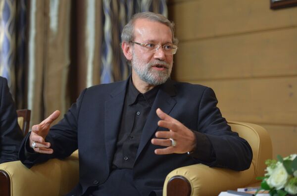 Speaker of the Islamic Consultative Council (parliament) of the Islamic Republic of Iran Ali Larijani during a meeting with Russian President Vladimir Putin following the 12th annual meeting of the Valdai International Discussion Club. File photo - Sputnik International