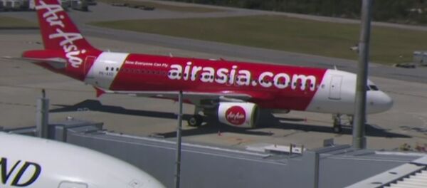 This Sunday, Oct. 15, 2017 image made from video shows an AirAsia plane at an airport in Perth, Australia. - Sputnik International
