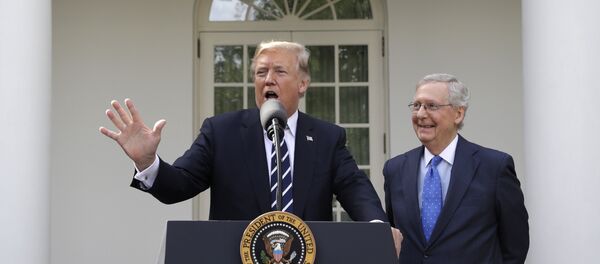 President Donald Trump answers questions with Senate Majority Leader Mitch McConnell, R-Ky., in the Rose Garden after their meeting at the White House, Monday, Oct. 16, 2017, in Washington. President Donald Trump answers questions with Senate Majority Leader Mitch McConnell, R-Ky., in the Rose Garden after their meeting at the White House, Monday, Oct. 16, 2017, in Washington. - Sputnik International