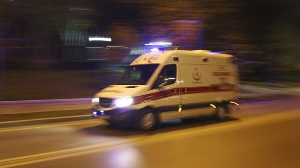 An ambulance rushes to the scene of explosions near the Besiktas football club stadium, in Istanbul, late Saturday, Dec. 10, 2016 - Sputnik International