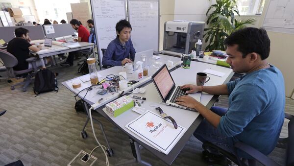 In this Thursday, June 30, 2016 photo, Babson College graduate school alumnus Abhinav Sureka, of Mumbai, India, right, types in his work space at the college in Wellesley, Mass. - Sputnik International