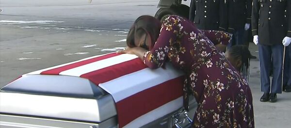 In this Tuesday, Oct. 17, 2017, frame from video, Myeshia Johnson cries over the casket of her husband, Sgt. La David Johnson, who was killed in an ambush in Niger, upon his body's arrival in Miami. In this Tuesday, Oct. 17, 2017, frame from video, Myeshia Johnson cries over the casket of her husband, Sgt. La David Johnson, who was killed in an ambush in Niger, upon his body's arrival in Miami. - Sputnik International