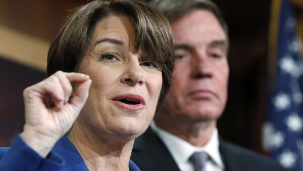 Sen. Amy Klobuchar, D-Minn., left, and Sen. Mark Warner, D-Va., speak about online political ads and preventing foreign interference in U.S. elections, during a news conference on Capitol Hill in Washington - Sputnik International