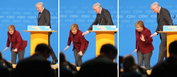 Combo shows German Chancellor and Christian Democratic Union (CDU) leader Angela Merkel stumbling on the stage as Bavarian State Premier and Christian Social Union (CSU) leader Horst Seehofer looks on during the Christian Democratic Union's (CDU) party in Karlsruhe, southern Germany, on December 15, 2015 Combo shows German Chancellor and Christian Democratic Union (CDU) leader Angela Merkel stumbling on the stage as Bavarian State Premier and Christian Social Union (CSU) leader Horst Seehofer looks on during the Christian Democratic Union's (CDU) party in Karlsruhe, southern Germany, on December 15, 2015 - Sputnik International