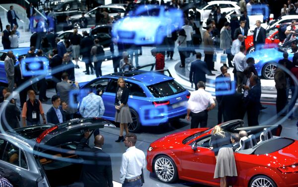 A projection of the Virtual Cockpit is seen as visitors inspect cars presented at the Audi stall during the media day at the Frankfurt Motor Show (IAA) in Frankfurt, Germany September 16, 2015 A projection of the Virtual Cockpit is seen as visitors inspect cars presented at the Audi stall during the media day at the Frankfurt Motor Show (IAA) in Frankfurt, Germany September 16, 2015 - Sputnik International