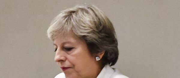 British Prime Minister Theresa May waits for the arrival of European Council President Donald Tusk prior to a bilateral meeting with European Council President Donald Tusk during an EU summit in Brussels on Friday, Oct. 20, 2017 - Sputnik International