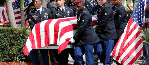 An honor guard carries the coffin of US Army Sergeant La David Johnson, who was among four special forces soldiers killed in Niger, at a graveside service in Hollywood, Florida, October 21, 2017. - Sputnik International